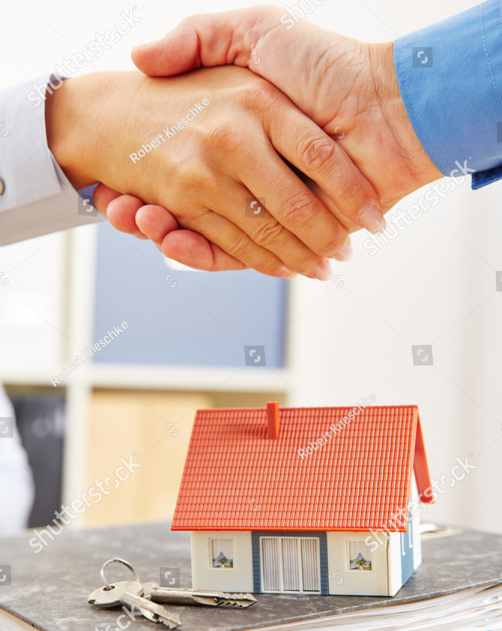 stock-photo-people-shake-hands-over-mortage-deal-for-financing-a-house-405422593